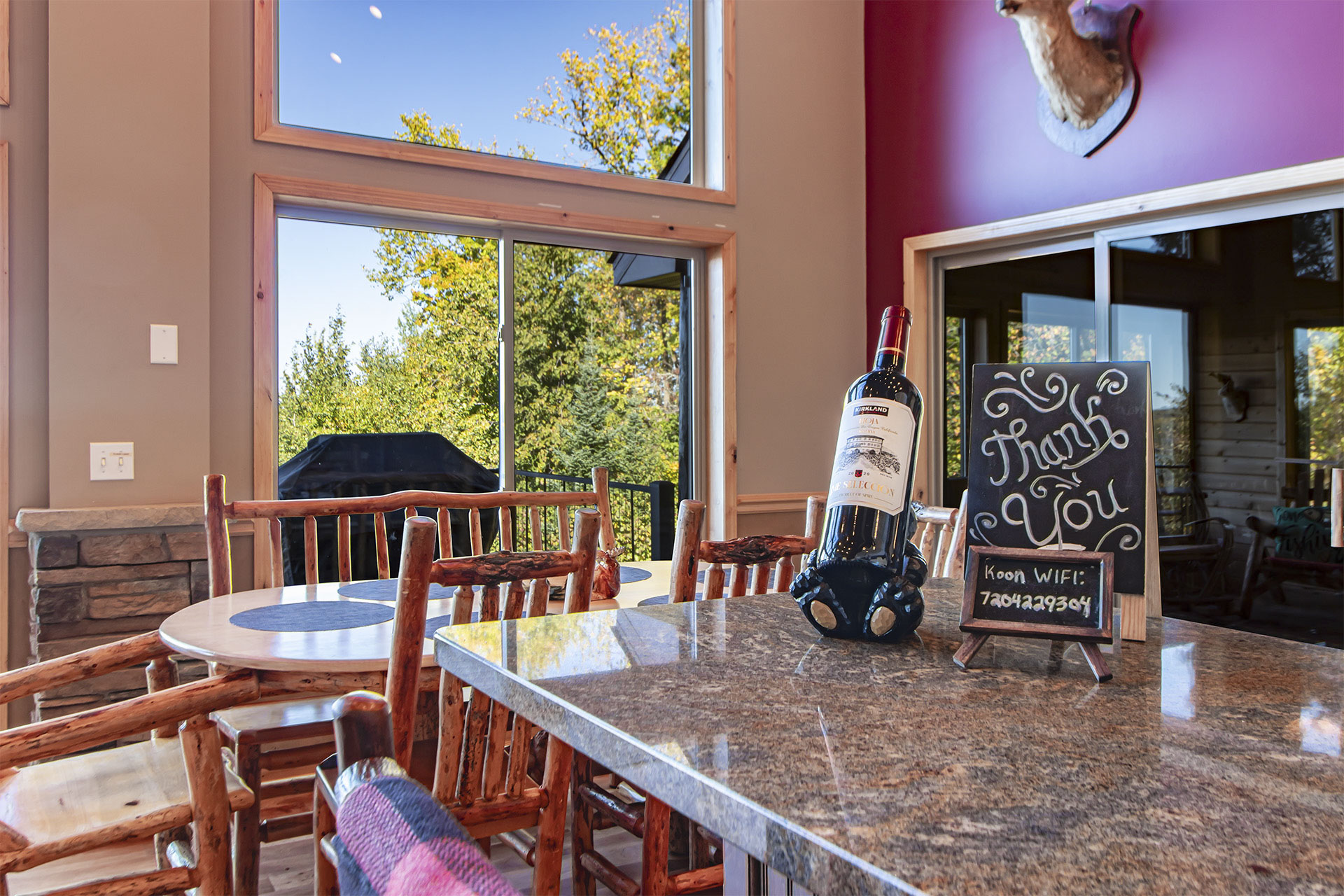 Kitchen and dining area with tall windows