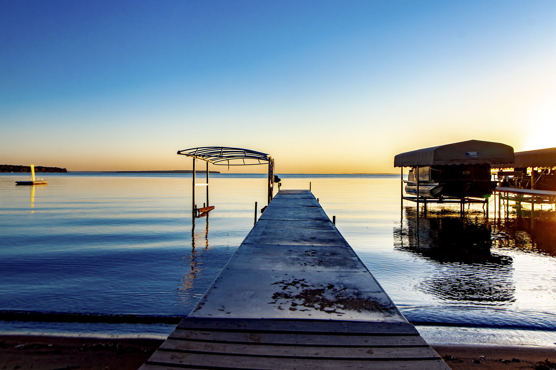 Sunset dock on calm water